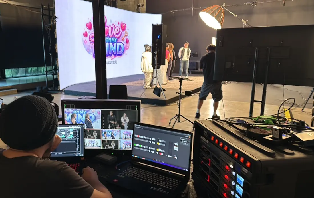 Studio A, Hollywood: operator at the switching position running a live LED-wall dating show, multiview and HyperDeck rack in the foreground