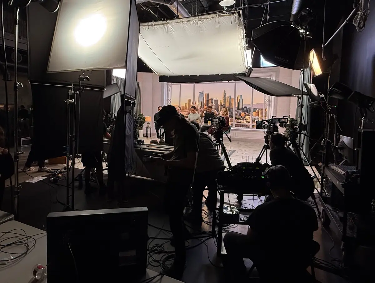 Studio A, Hollywood: a full set build with a Los Angeles skyline backdrop, crew, multiple camera positions and a large overhead soft source